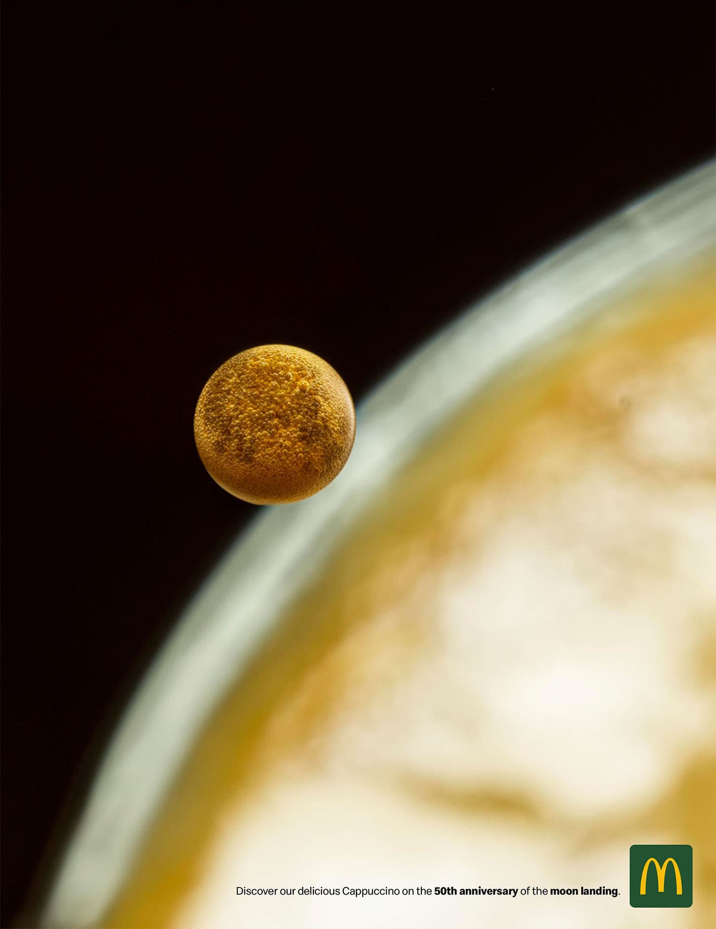 A close up of a Cappuccino mimicking the image of the moon and the earth taken on the Apollo 11 mission. This Campaign celebrates the 50th Anniversary of the landing on the Moon