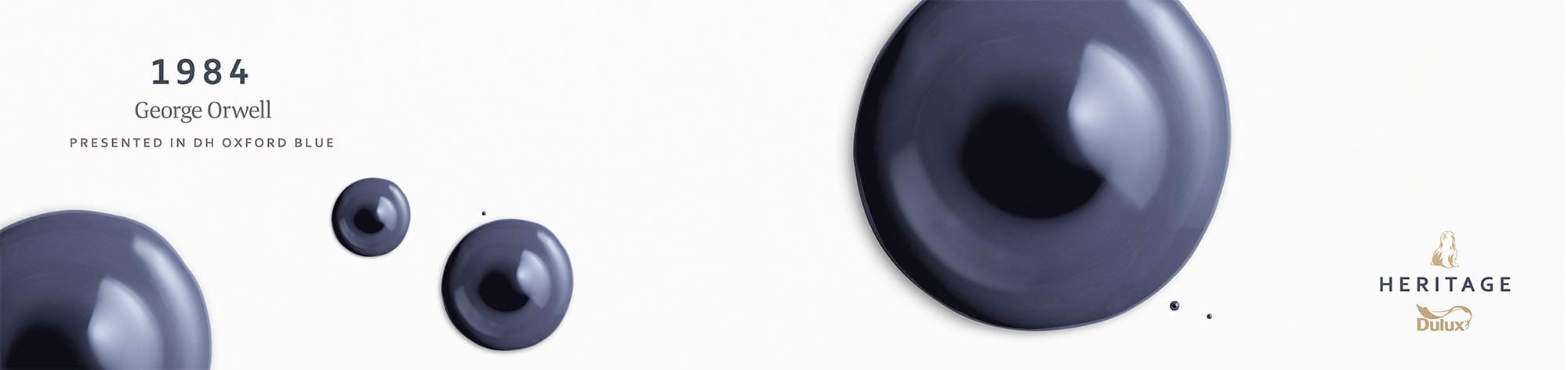 Large droplet of oxford blue Dulux Heritage with a darker shade of blue in the centre.