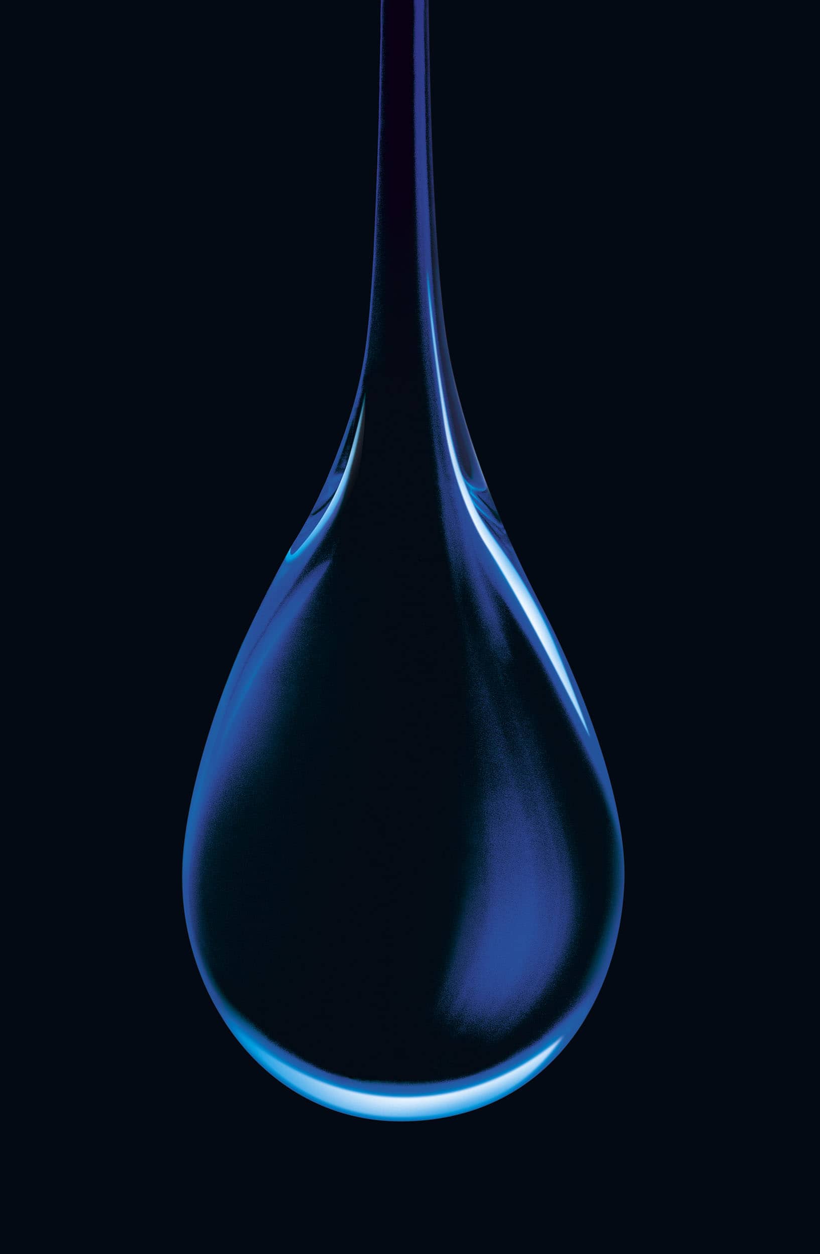 Macro image of a single droplet of blue liquid on a black background