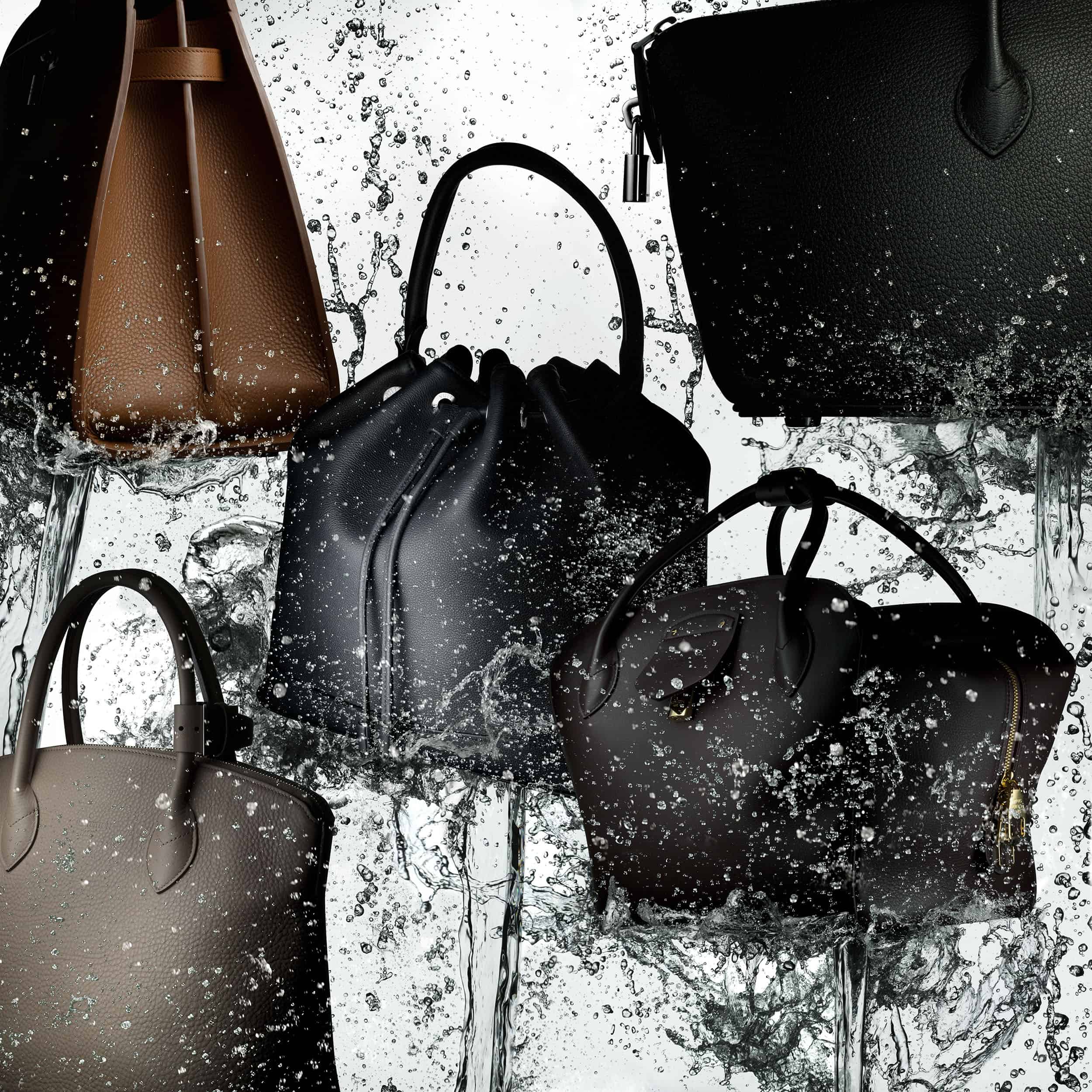 Louis Vuitton brown and black tote bags suspended in mid-air and splashed with water. Image taken by still photographer and liquid specialist Jonathan Knowles