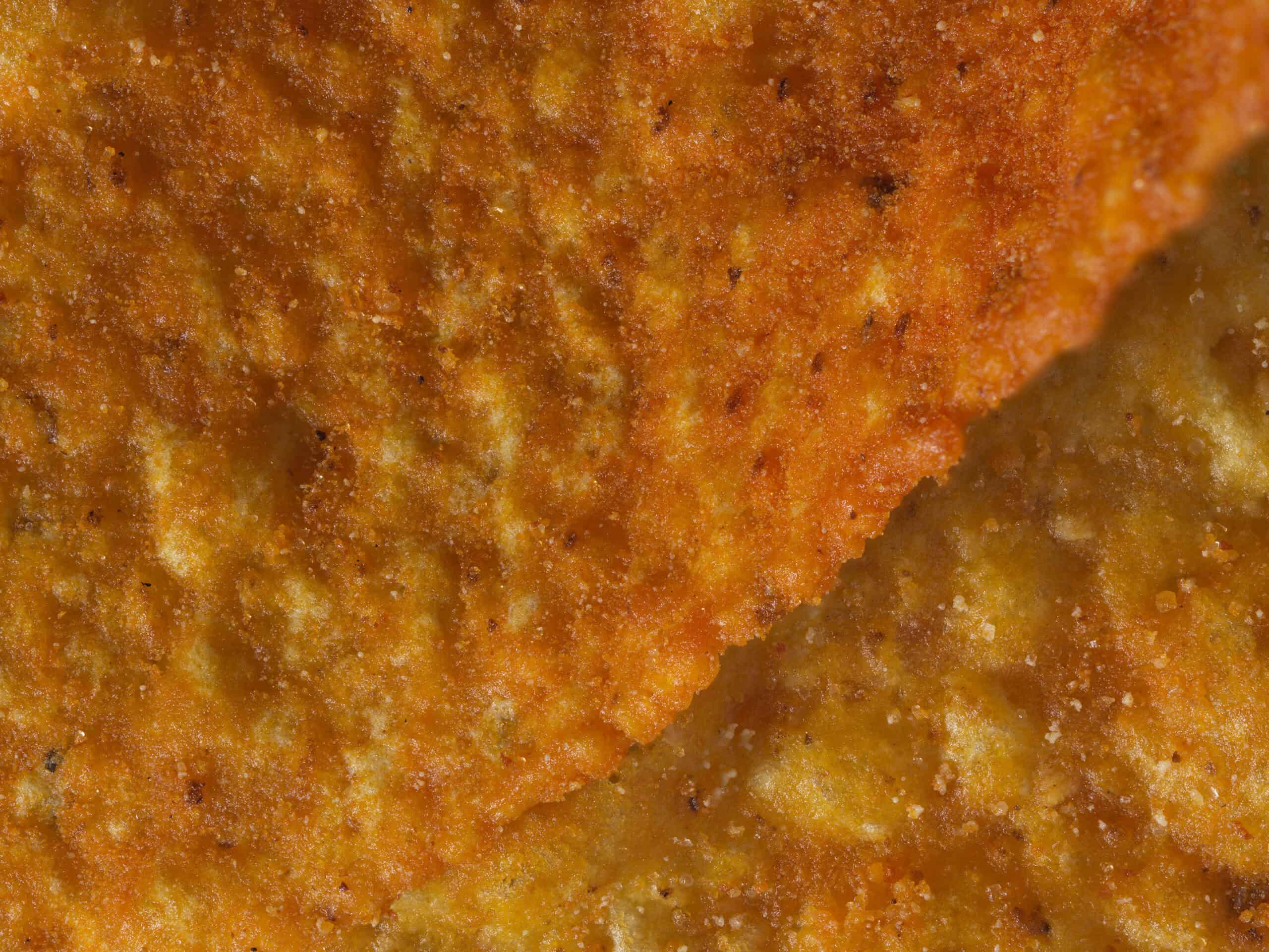 Macro image of cheese flavoured Dorito crisps